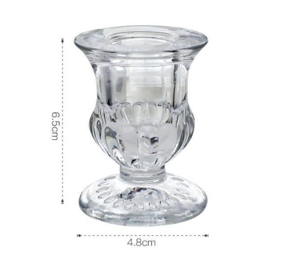 small clear pedestal glass candle holder measuring 6.5 by 4.8 centimeters