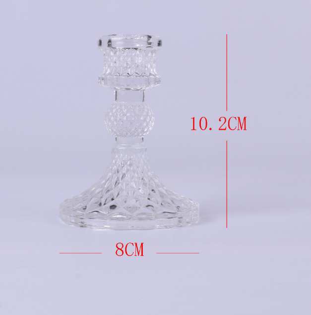 dimensioned clear glass candle holder measuring 10.2 by 8 centimeters